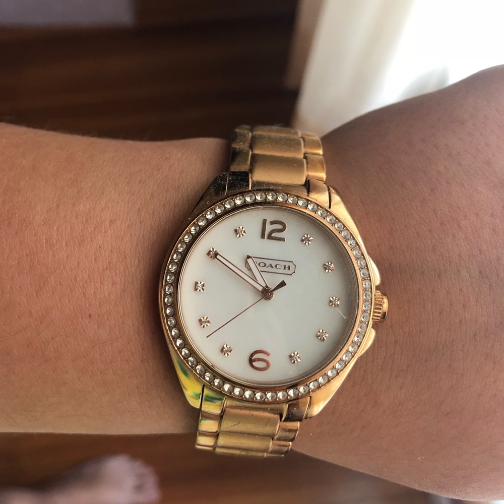 Rose gold woman’s coach watch